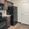 a kitchen with black appliances